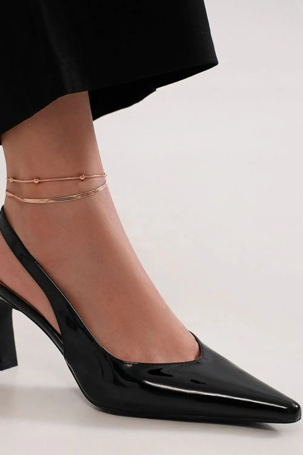 Black Beast Fashion faux leather point toe slingback pumps with low heel and stylish design by Trendsi.