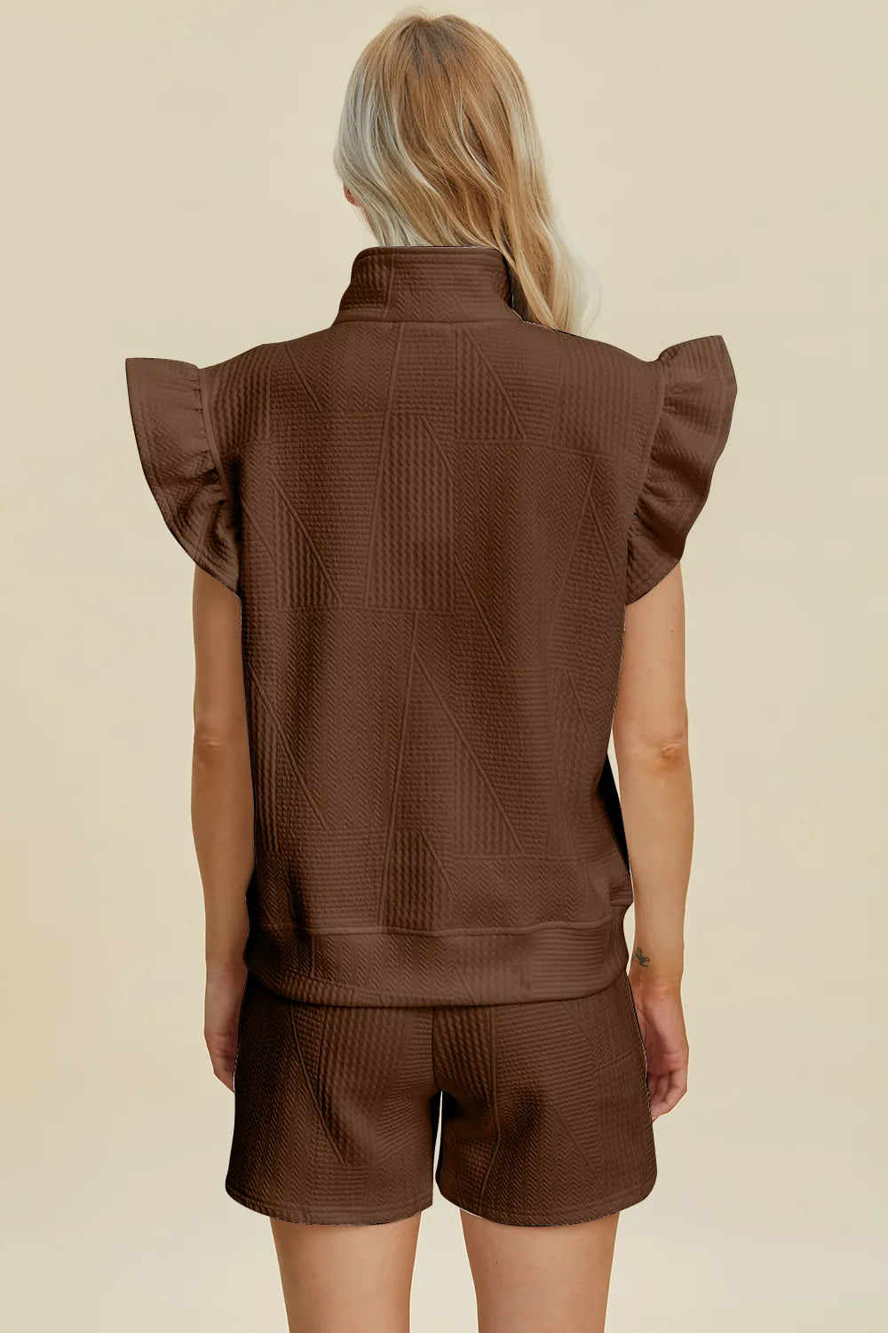 Black double take texture flounce sleeve top and shorts set by Trendsi, featuring stylish design and comfortable fit.
