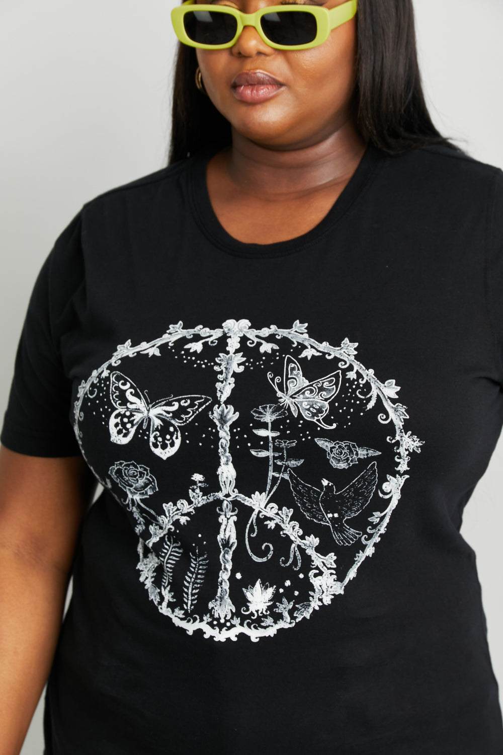 Black mineB butterfly graphic tee shirt from Trendsi, full size, with vibrant butterfly design on soft cotton fabric