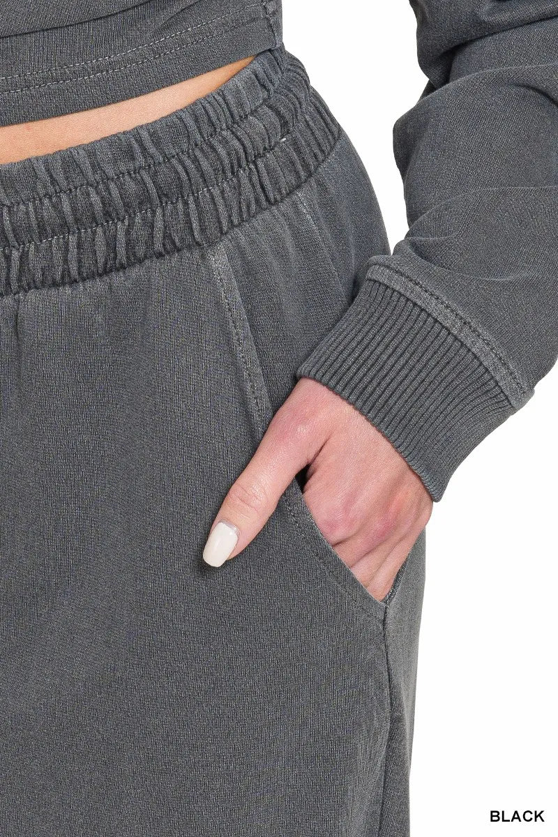 Black Zenana washed fleece pullover and pants set by Trendsi, featuring a round neck and cozy relaxed fit.