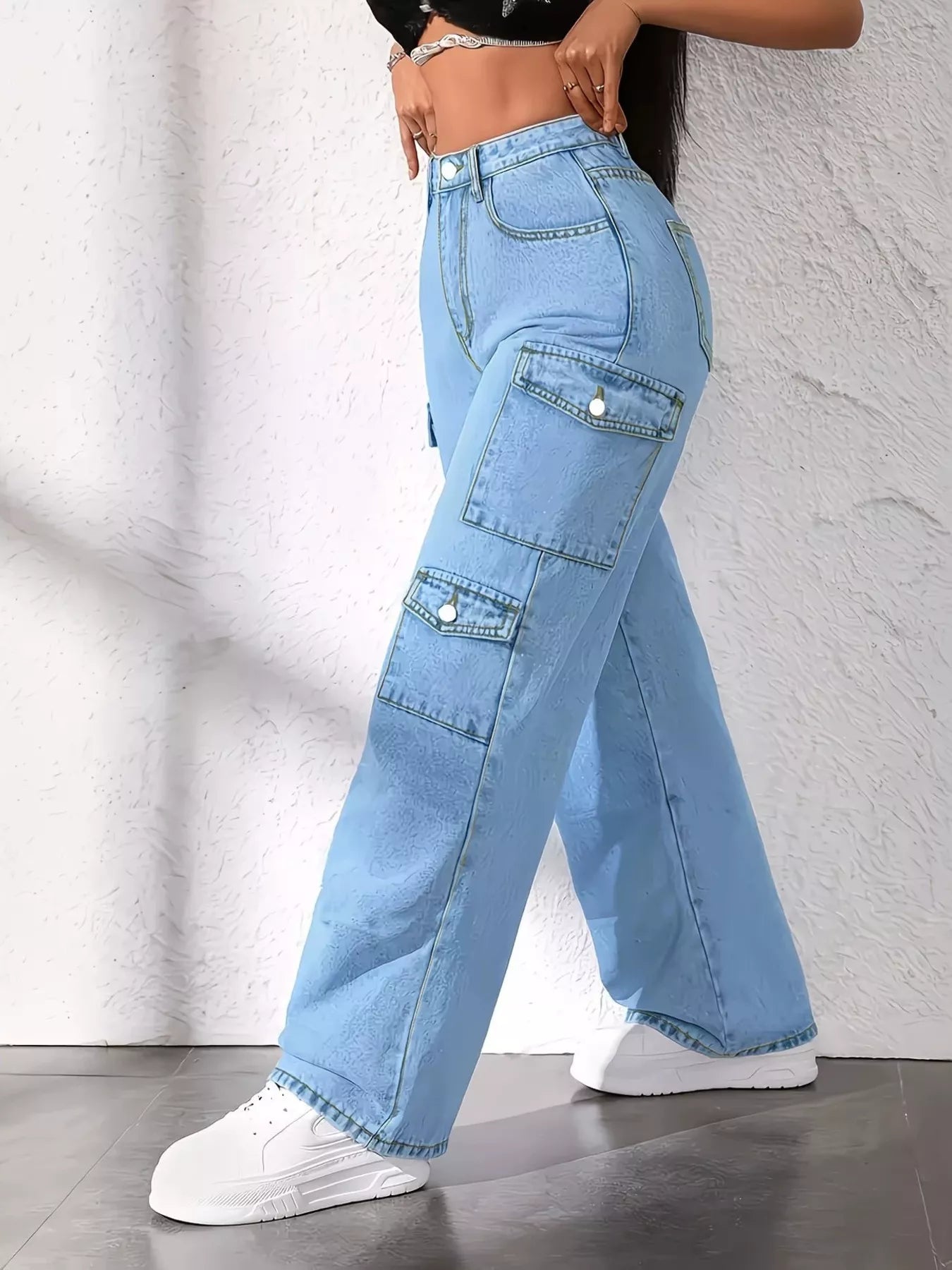 Blue high waist cargo jeans by Trendsi, featuring multiple pockets and a relaxed fit, styled for casual wear.