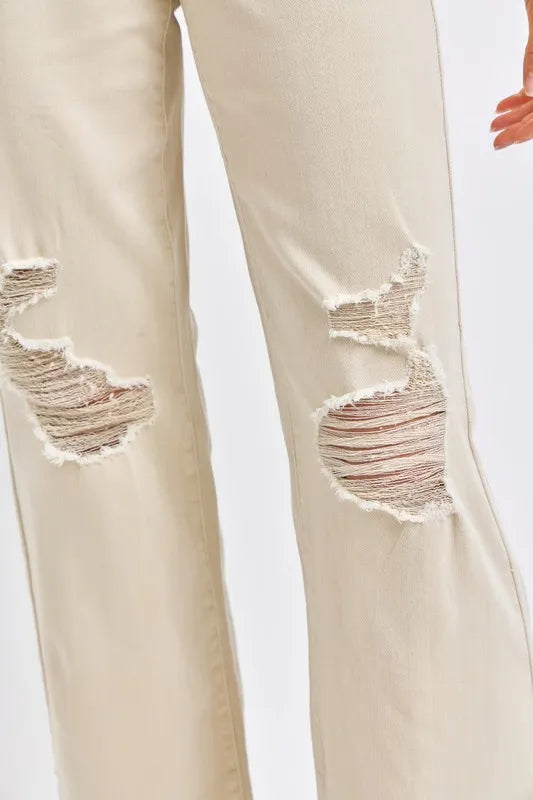 Full view of Judy Blue high waist distressed wide-leg jeans, showcasing the relaxed fit and ripped details for a trendy casual look.