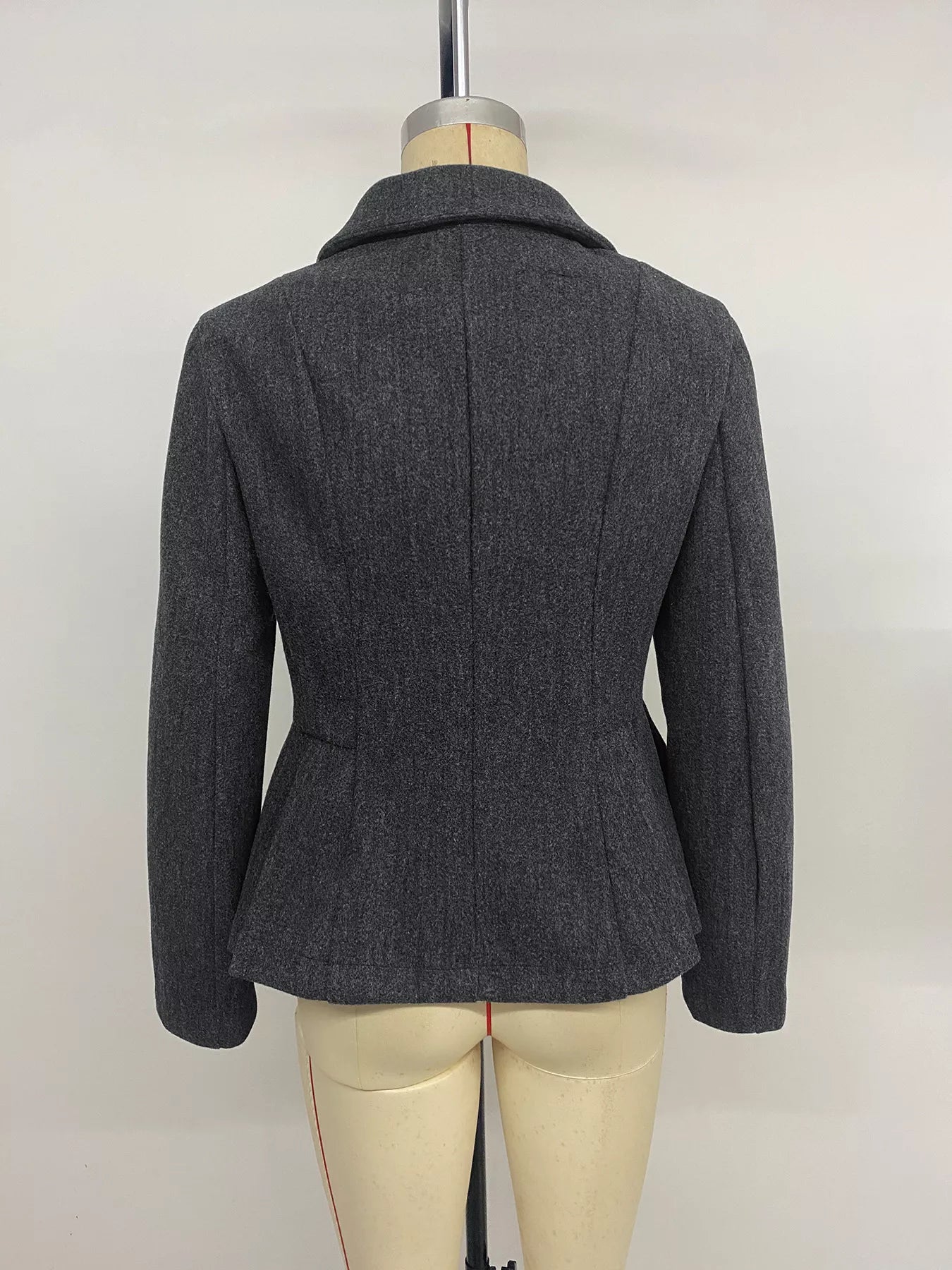 Dark gray double-breasted peplum blazer by Trendsi, featuring a tailored fit with structured shoulders and classic design.