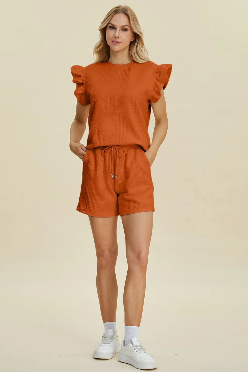 Dark green Trendsi Double Take textured round neck top with ruffle sleeves and matching shorts set, casual and stylish.