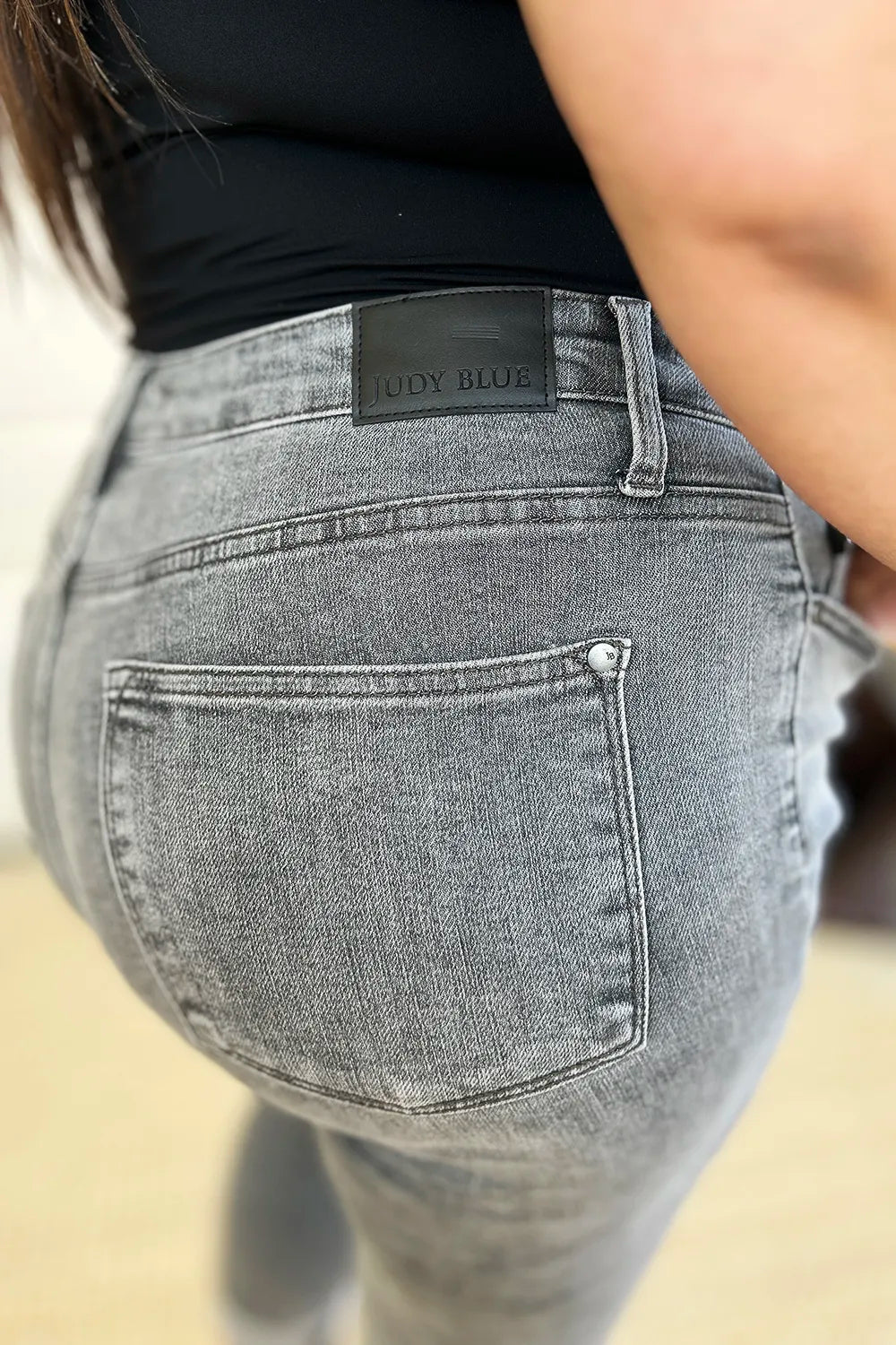 Gray Judy Blue full-size button fly high-waist cuffed capris with front pockets and rolled cuffs, perfect for casual wear.
