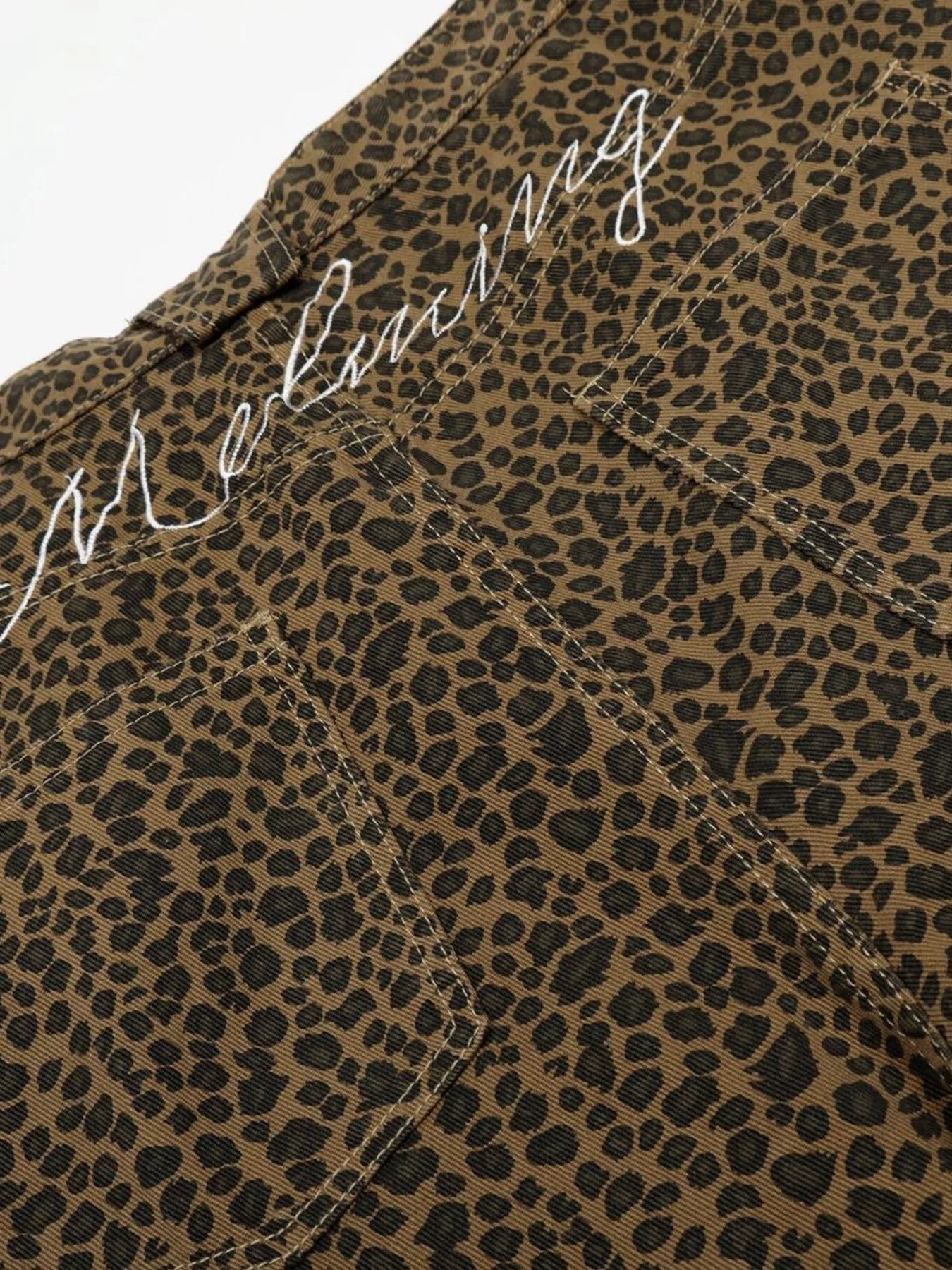 Men's leopard print wide-leg capris by Trendsi featuring a stylish animal print and relaxed fit, perfect for casual wear.