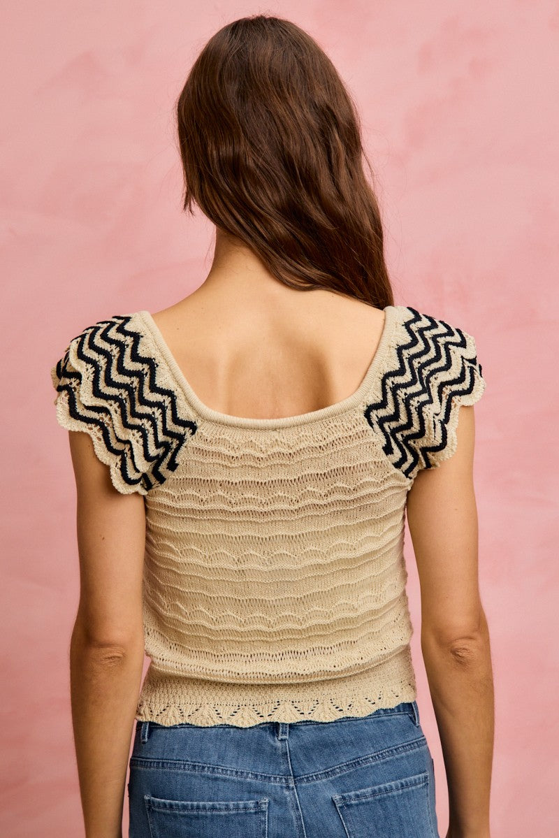 Oatmeal and black SO ME wavy textured knit top with fluttered sleeves, casual women's fashion by Trendsi.