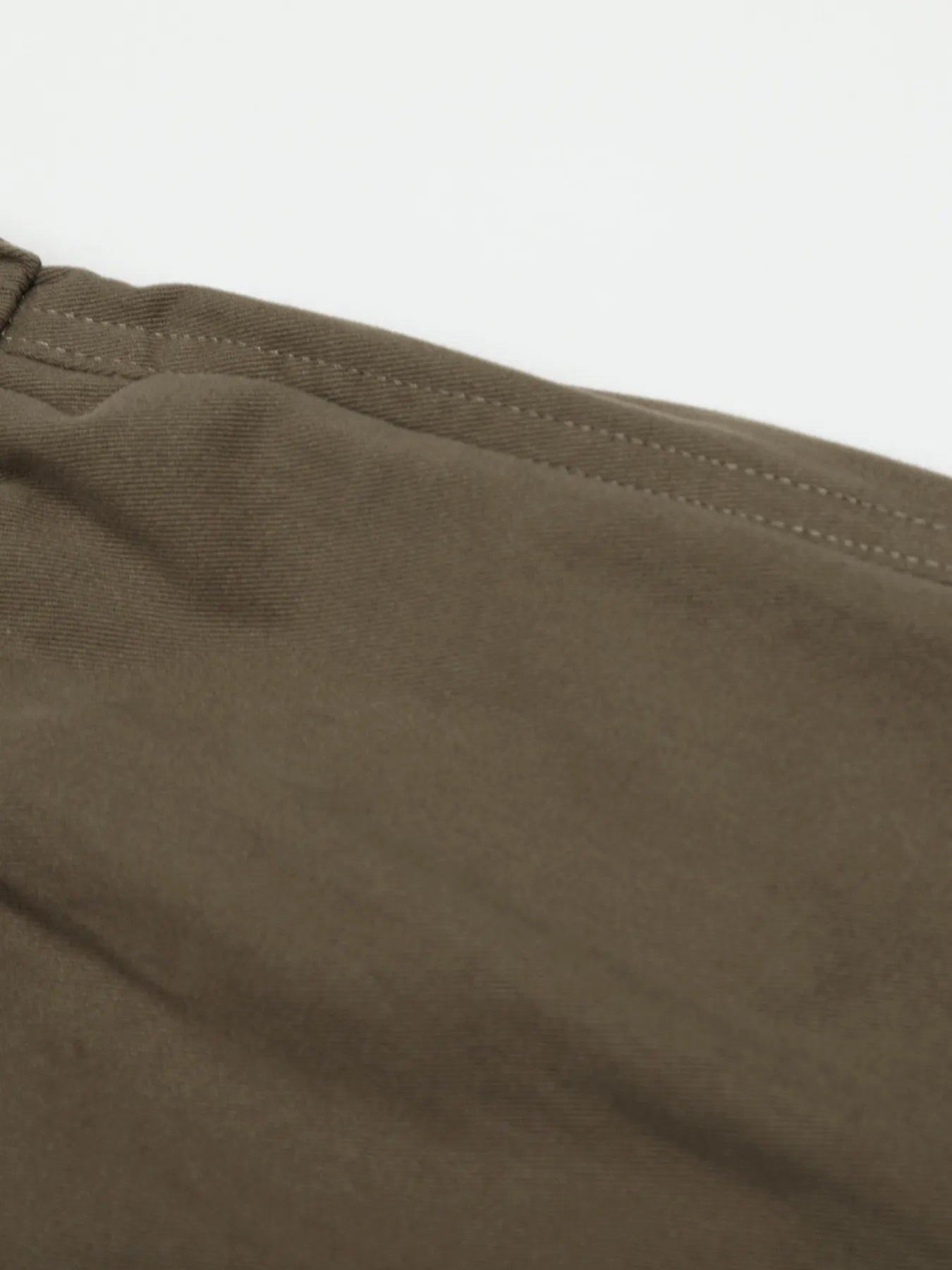 Men's olive brown wide leg drawstring elastic waist pants from Trendsi, featuring a relaxed fit and comfortable design.