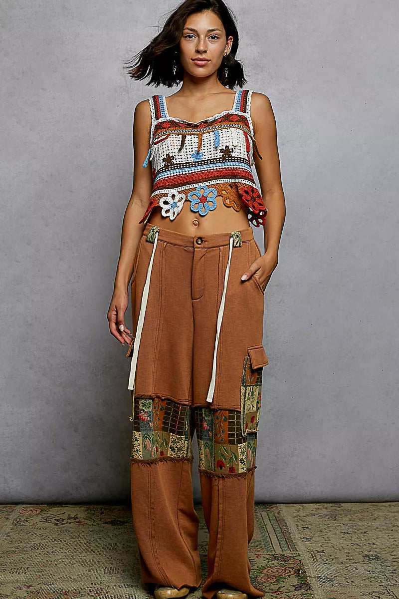 Orange multi POL cutout flower cropped crochet cami with dangle detail, featuring floral design and trendy crochet texture.