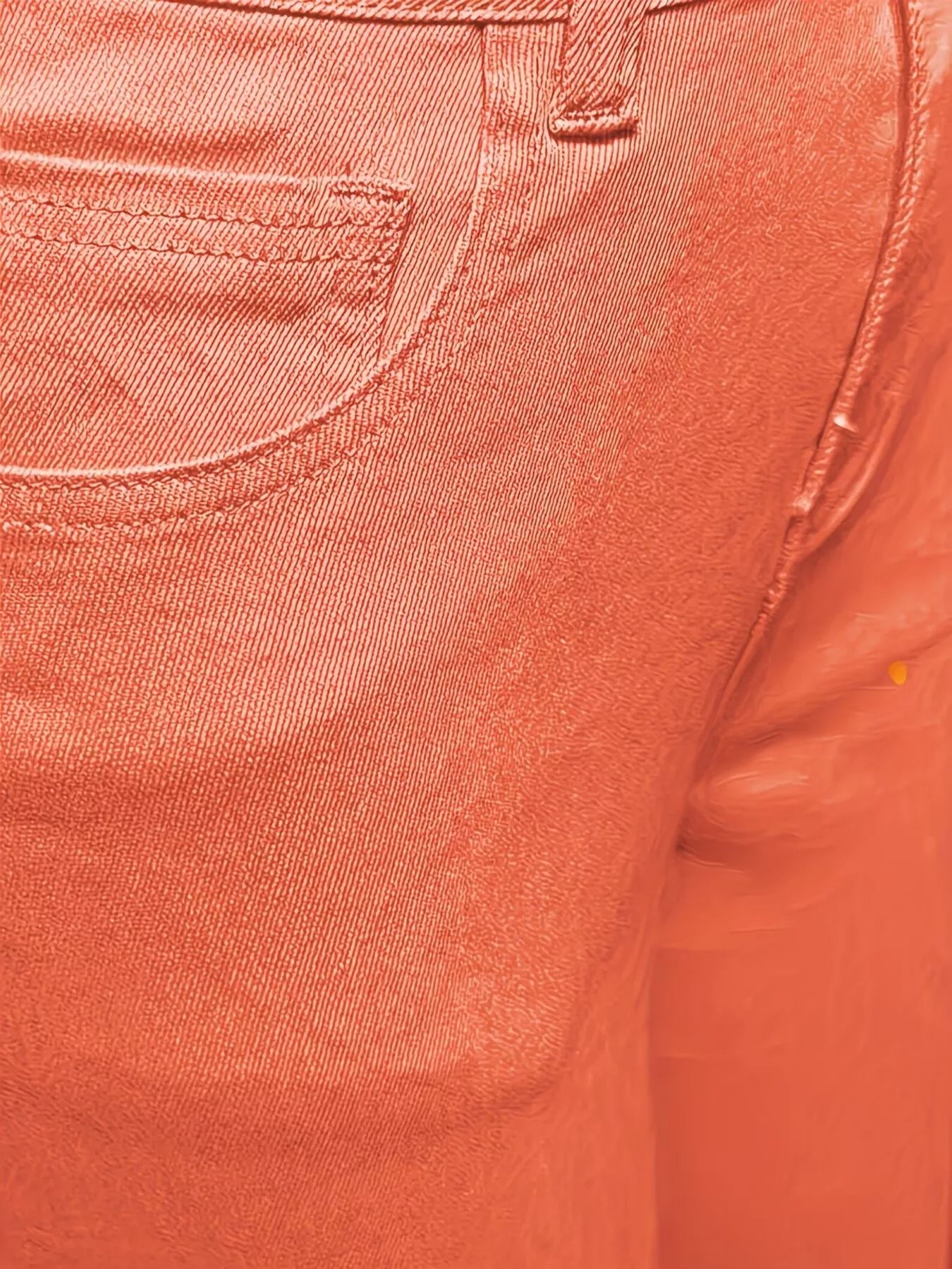 Orange raw hem wide leg jeans by Trendsi, featuring a relaxed fit and stylish distressed detailing.