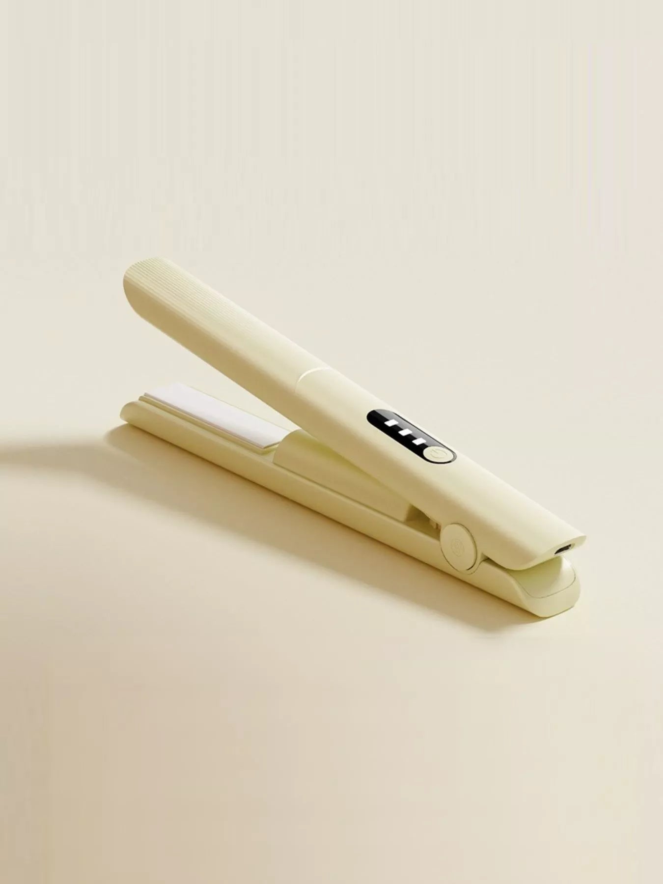 Pink rechargeable hair straightener from Trendsi with a sleek design and ceramic plates for smooth styling.