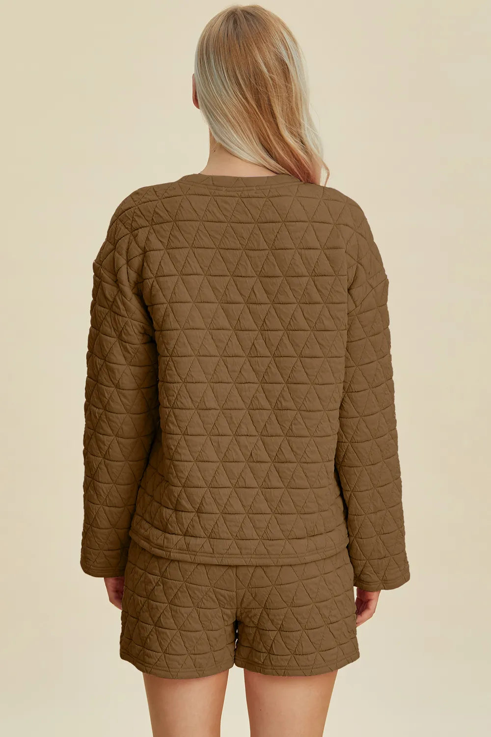 Pink double take texture long sleeve top and shorts set by Trendsi, featuring a round neck and casual, comfortable style.