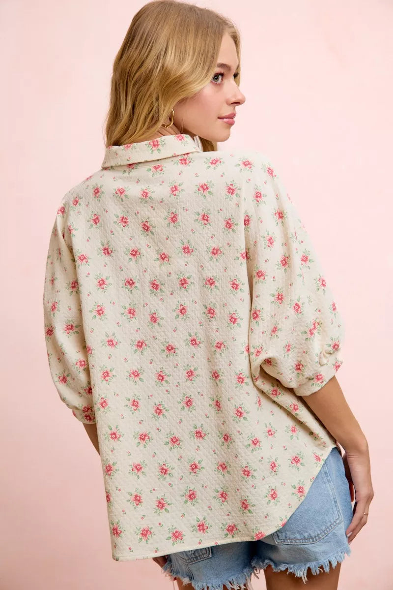 Red flower printed short dolman blouse top by Trendsi featuring a flowy, relaxed fit and vibrant floral design.