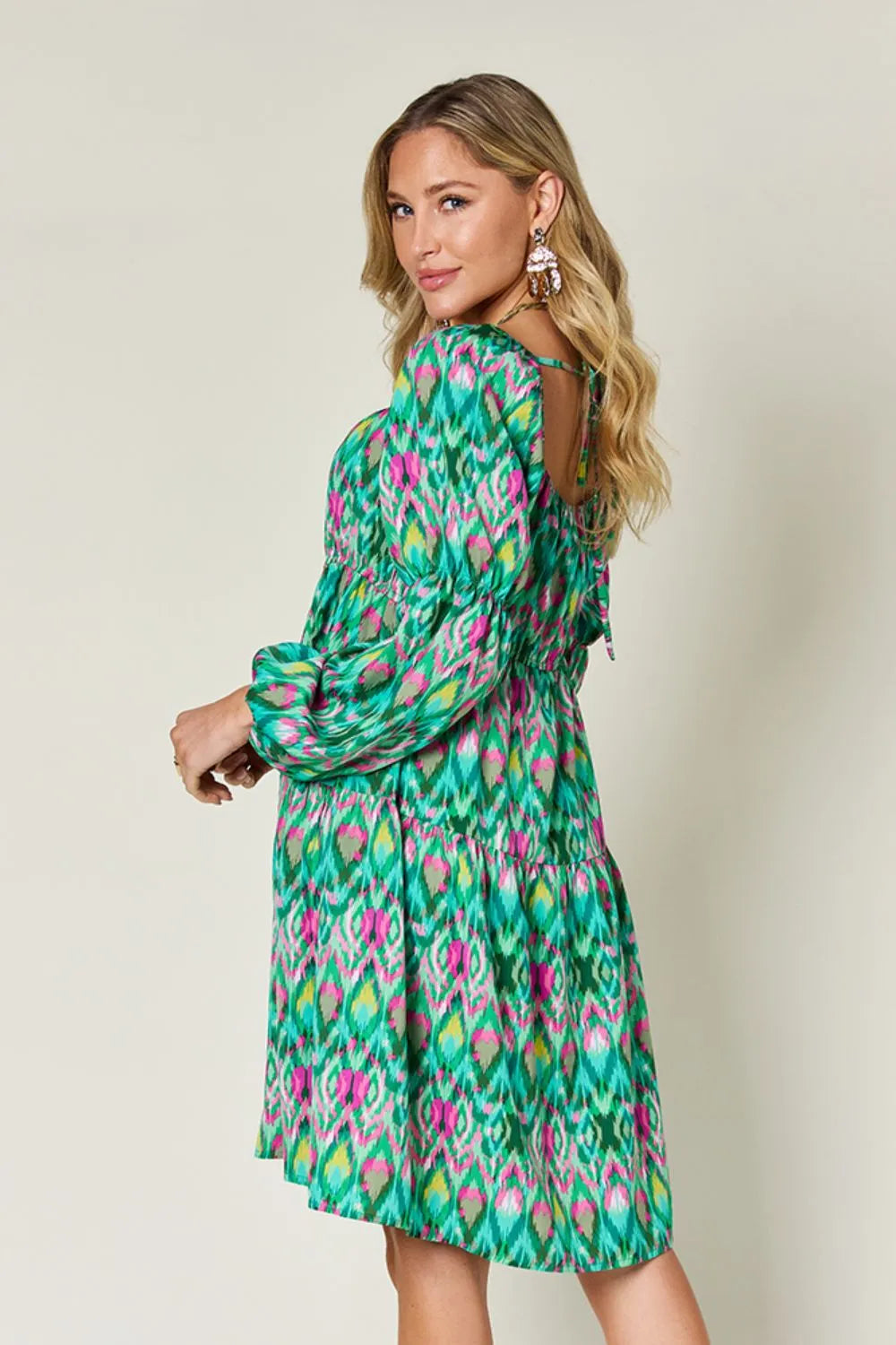 Long sleeve printed dress from the Double Take Full Size collection by Trendsi, showcasing a vibrant pattern and comfortable fit.