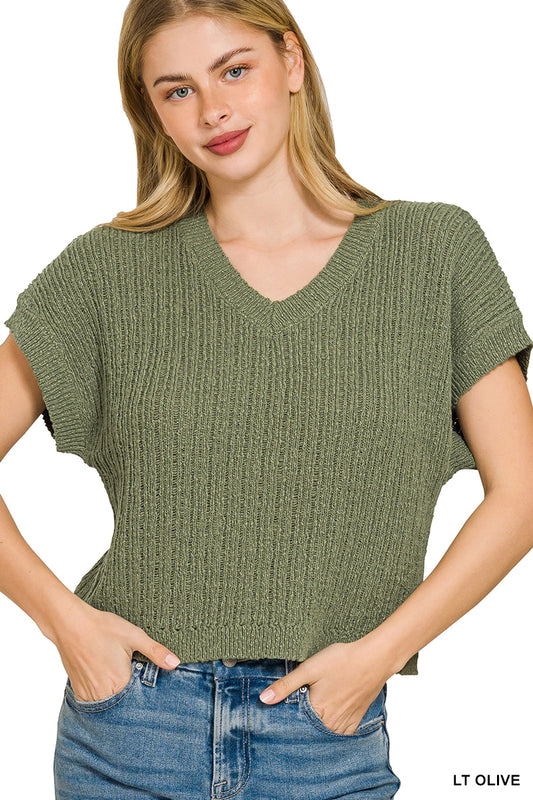 Textured knit V-neck cropped sweater by Trendsi, featuring a cozy design with a stylish fit and subtle pattern.