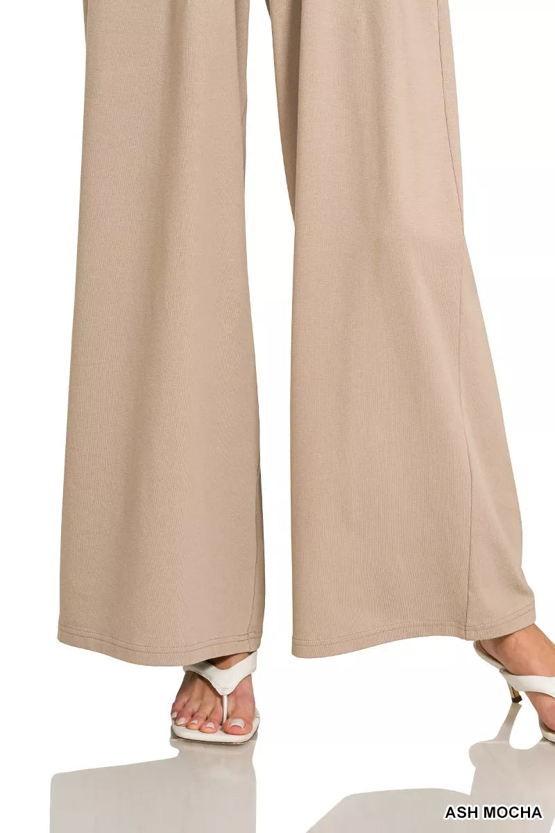 Zenana tube top jumpsuit with drawstring waist, featuring a sleek, fitted design and stylish sleeveless silhouette.