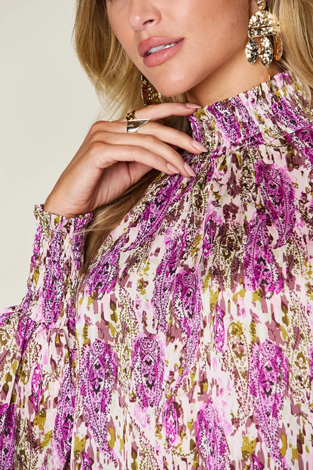 Printed smocked long sleeve blouse from Trendsi with a double take full size design, featuring a stylish and comfortable fit.
