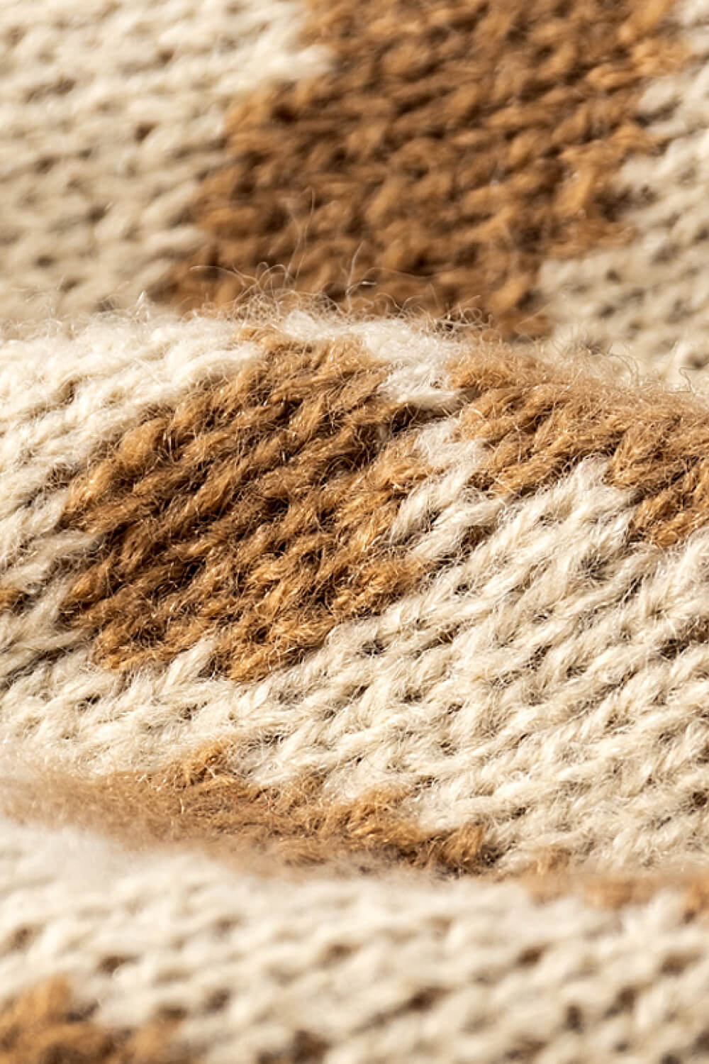 Leopard print pom-pom cuffed beanie hat by Trendsi featuring a cozy knit design and playful fur pom-pom on top.