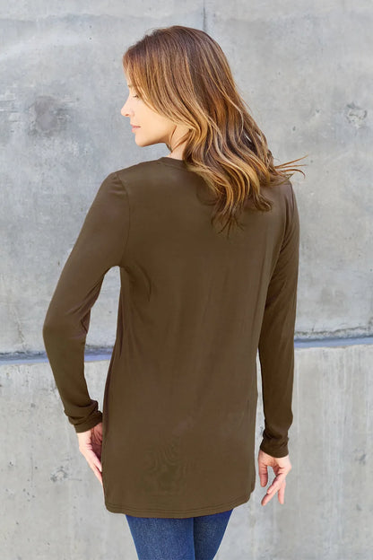 Trendsi Basic Bae full size round neck long sleeve top in a solid color, close-up of the soft fabric and classic fit.