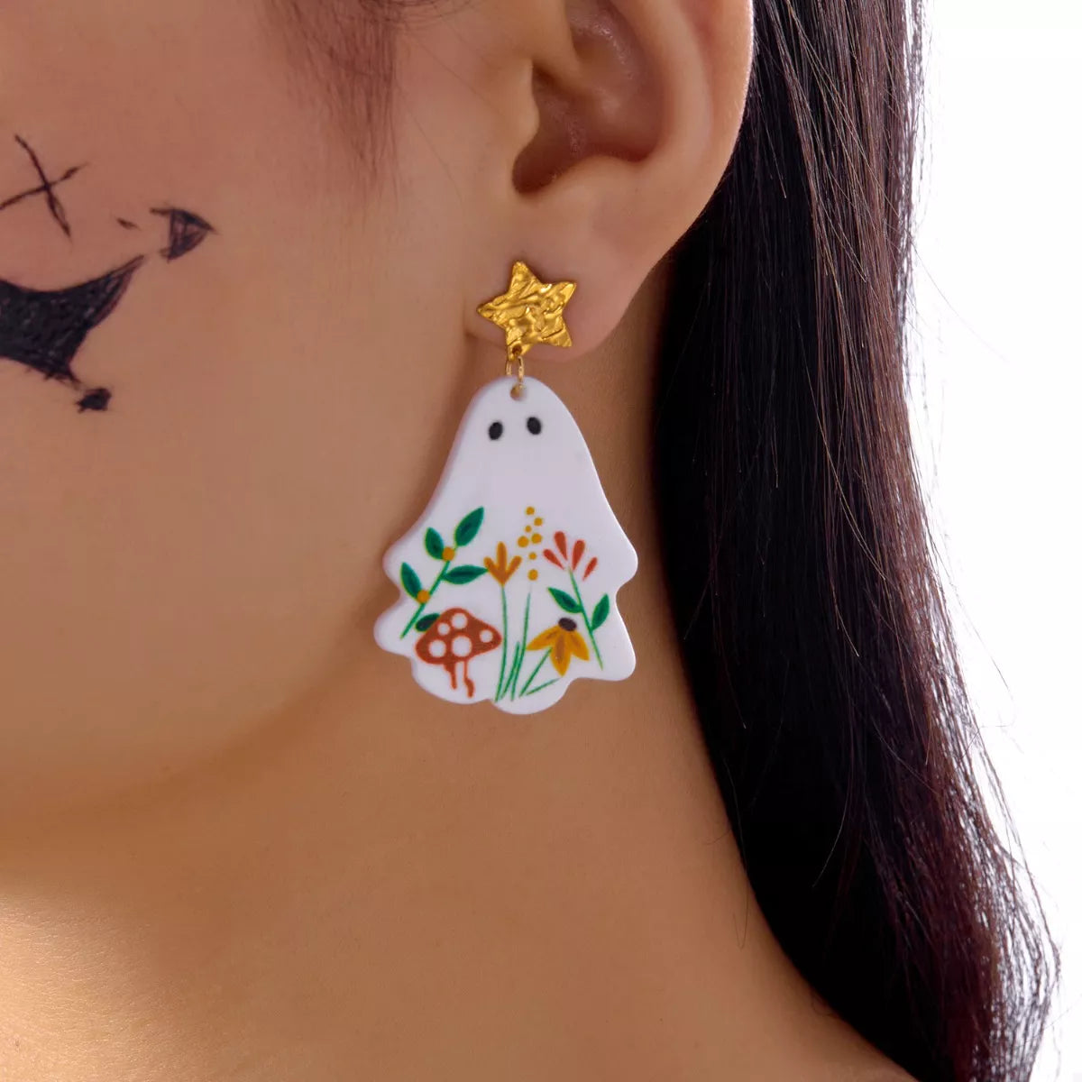 Whimsical ghost earrings with floral design by Trendsi, featuring playful ghost figures adorned with delicate floral accents.