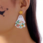 Whimsical ghost earrings with floral design by Trendsi, featuring playful ghost figures adorned with delicate floral accents.