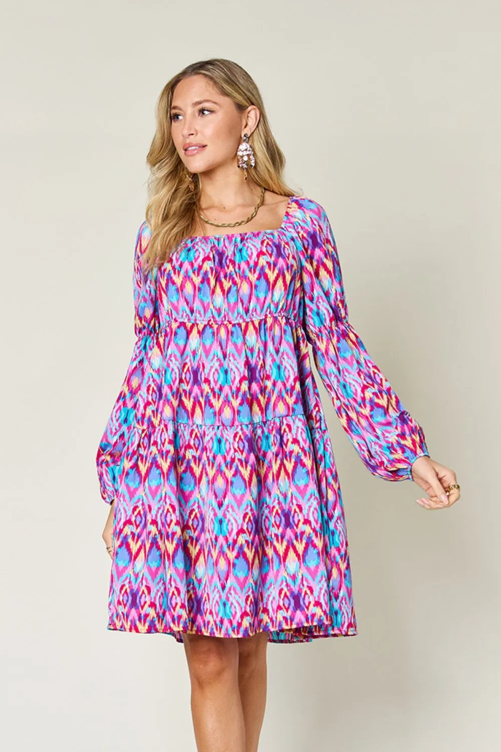 Printed long sleeve dress by Trendsi, featuring a full size design with a stylish pattern and comfortable fit.