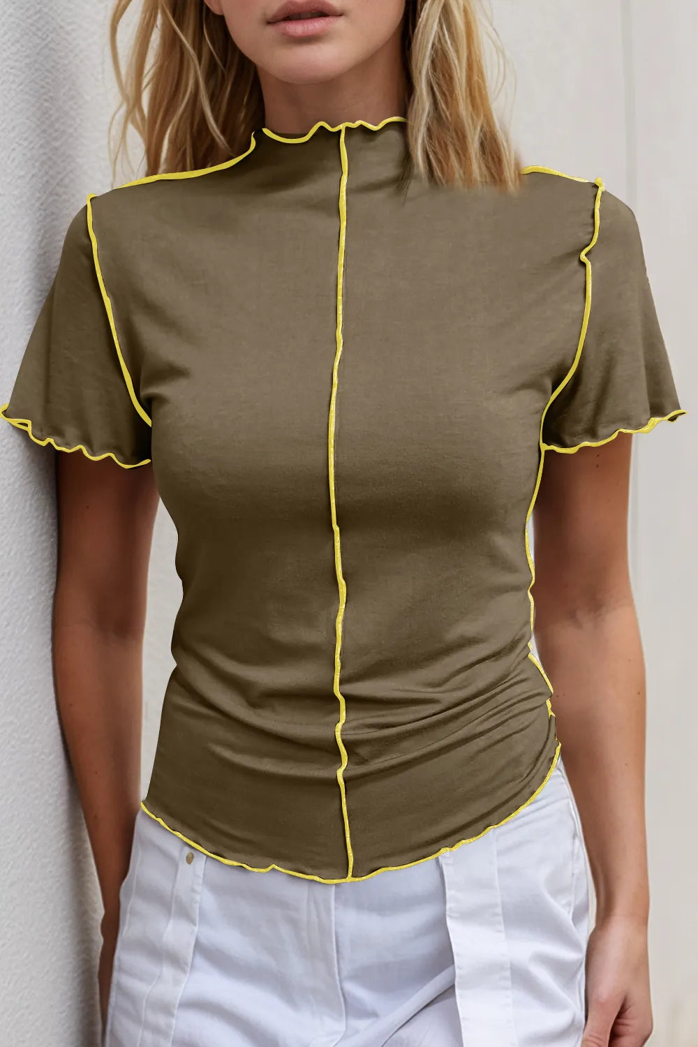 Casual slim fit ruffle short sleeve top with contrast stitching and mock neck, featuring wave edge design by Trendsi.
