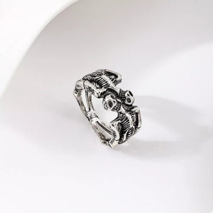 Black alloy Halloween skull ring with detailed skull design, perfect for gothic or spooky fashion accessories.