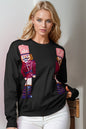 Trendsi Double Take full size sweater with sequins, long sleeve knit sweater featuring a bold nutcracker design and festive style.