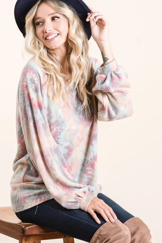 BiBi brushed tie dye print top with puff sleeves, trendy fashion piece, shown in a close-up image highlighting fabric and sleeve details.