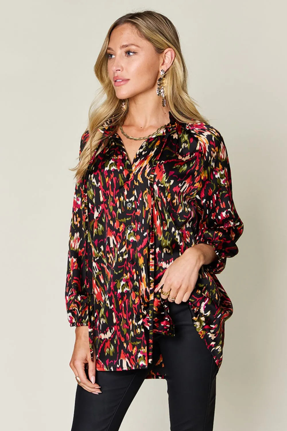 Plus size double take printed button-up long sleeve shirt from Trendsi, featuring bold patterns and classic collar.