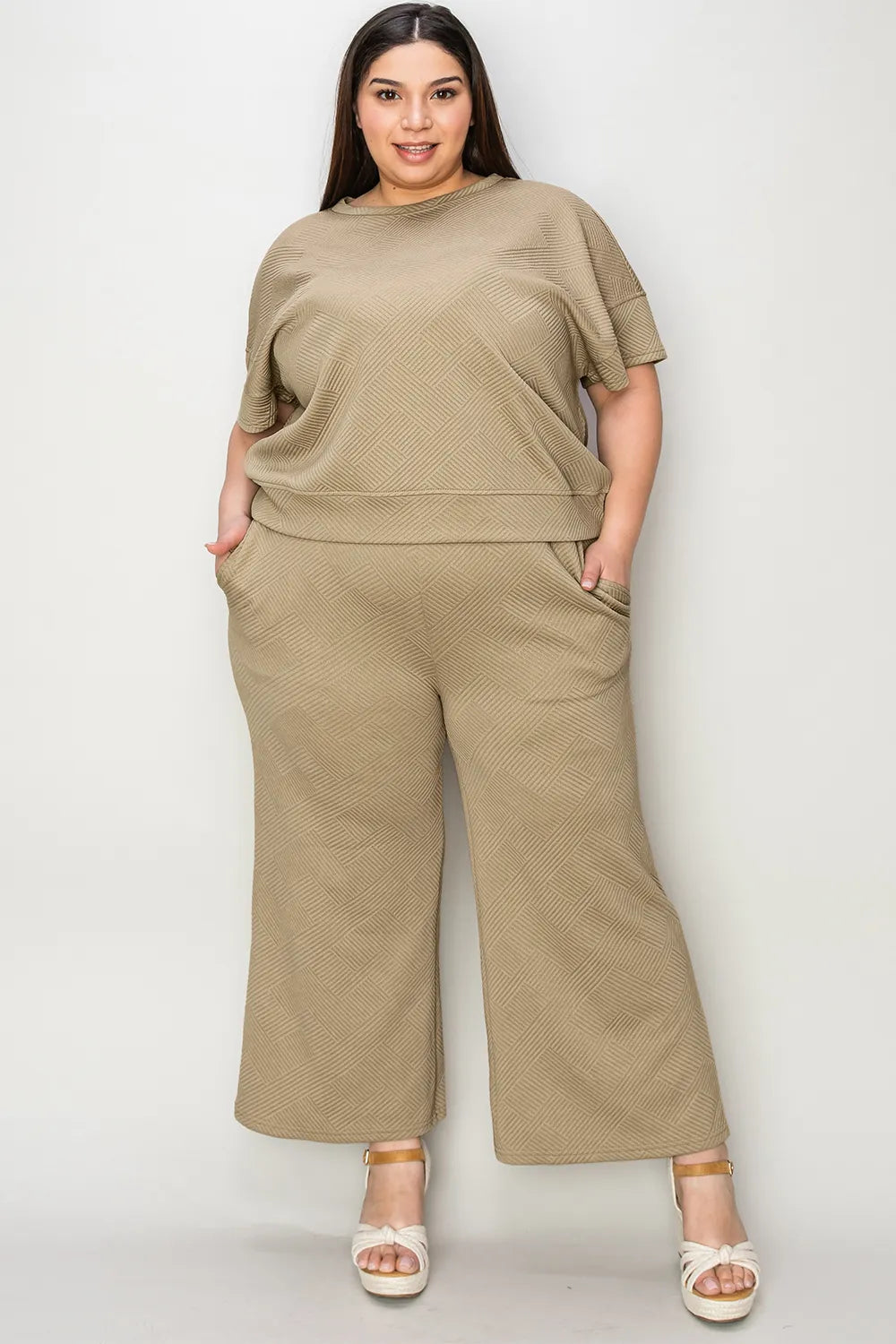 Trendsi double take full size texture short sleeve top and matching pants set, featuring a stylish, textured fabric in a coordinated outfit.