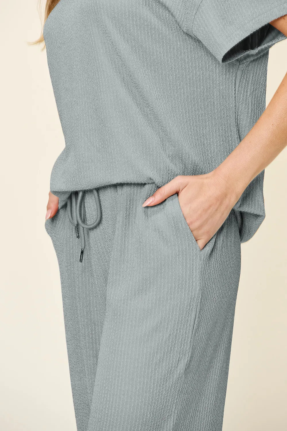 Trendsi double take full size round neck short sleeve T-shirt paired with wide-leg pants, textured fabric, casual fashion outfit.