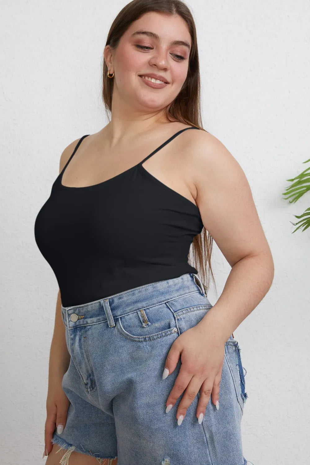 Plus size Basic Bae full size round neck slim cami by Trendsi, featuring a close-up of the fitted round neckline and smooth fabric.