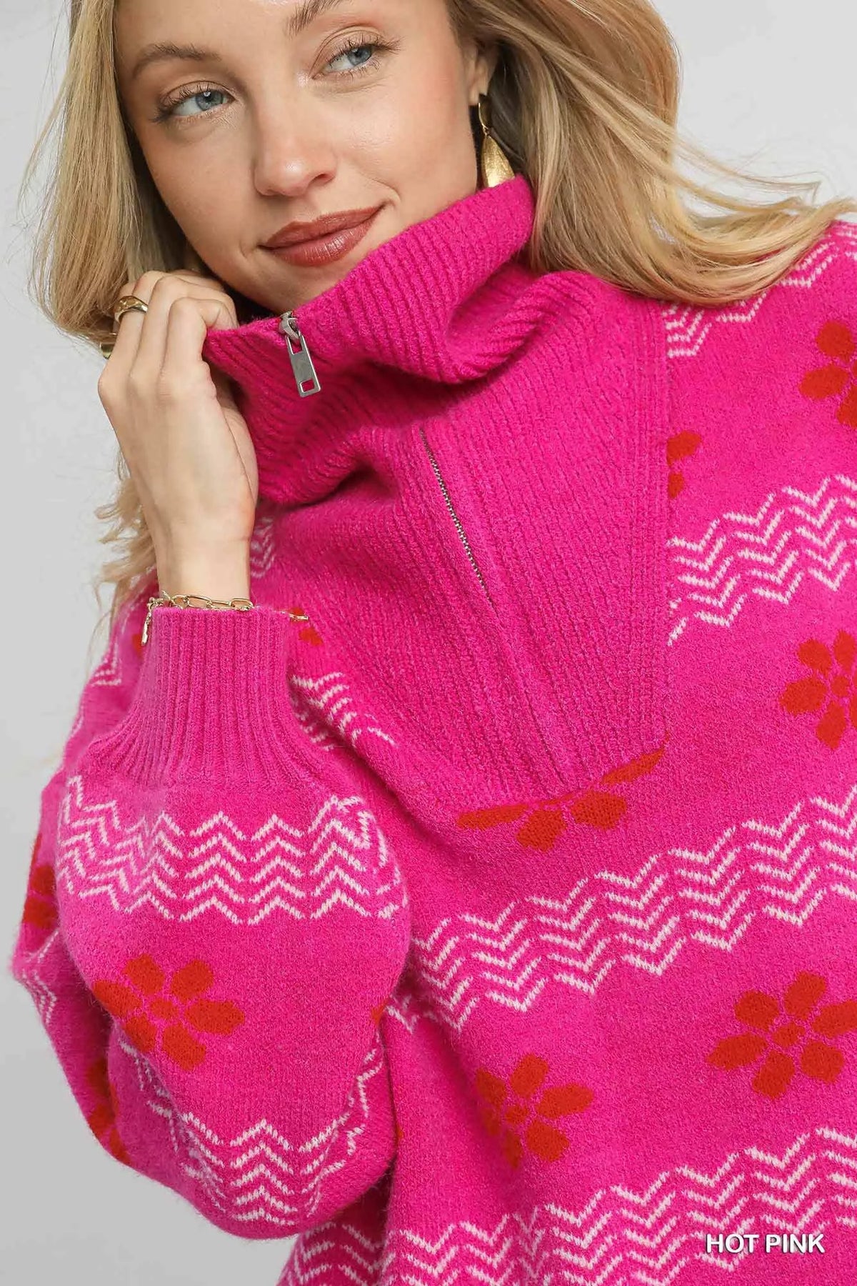 Umgee floral patterned jacquard quarter-zip pullover sweater featuring a vibrant floral design and cozy knit texture.