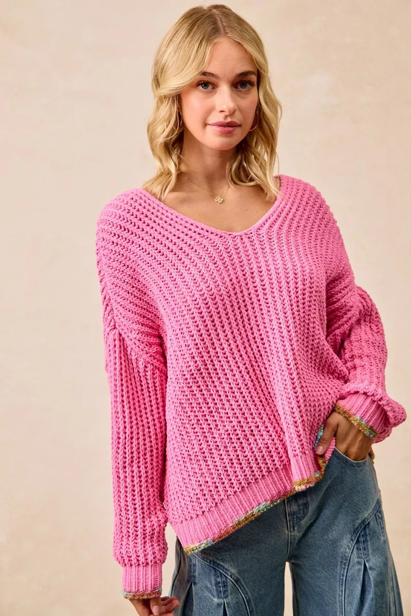 BiBi V-neck sweater by Trendsi with colorful trim, featuring a cozy knit fabric and vibrant accents on the neckline.