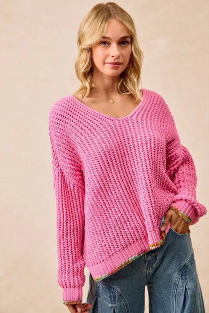 BiBi V-neck sweater by Trendsi with colorful trim, featuring a cozy knit fabric and vibrant accents on the neckline.