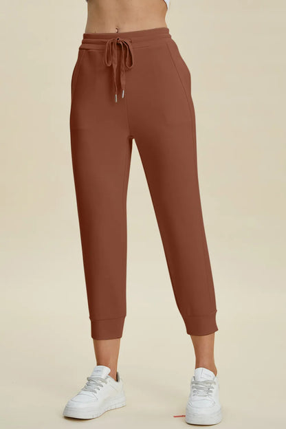 Trendsi Basic Bae full-size air scuba drawstring high-waist cropped pants in black, featuring a comfortable fit and stylish design.