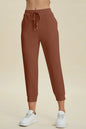 Trendsi Basic Bae full-size air scuba drawstring high-waist cropped pants in black, featuring a comfortable fit and stylish design.