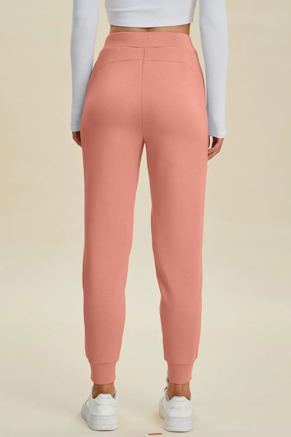 Black high waist joggers with drawstring, full size air scuba fabric, trendy Basic Bae by Trendsi, shown on a model.