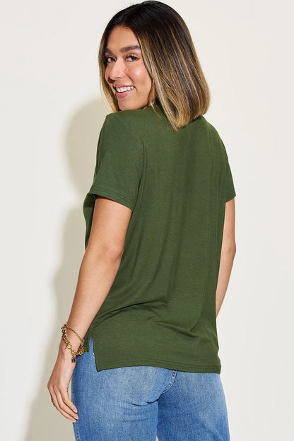 Basic Bae full-size V-neck high-low T-shirt from Trendsi, featuring a soft fabric, relaxed fit, and stylish V-neck design.