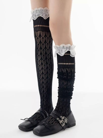 Lace over-the-knee hollow-out stockings from Trendsi, featuring intricate lace detailing and sheer fabric for a stylish look.