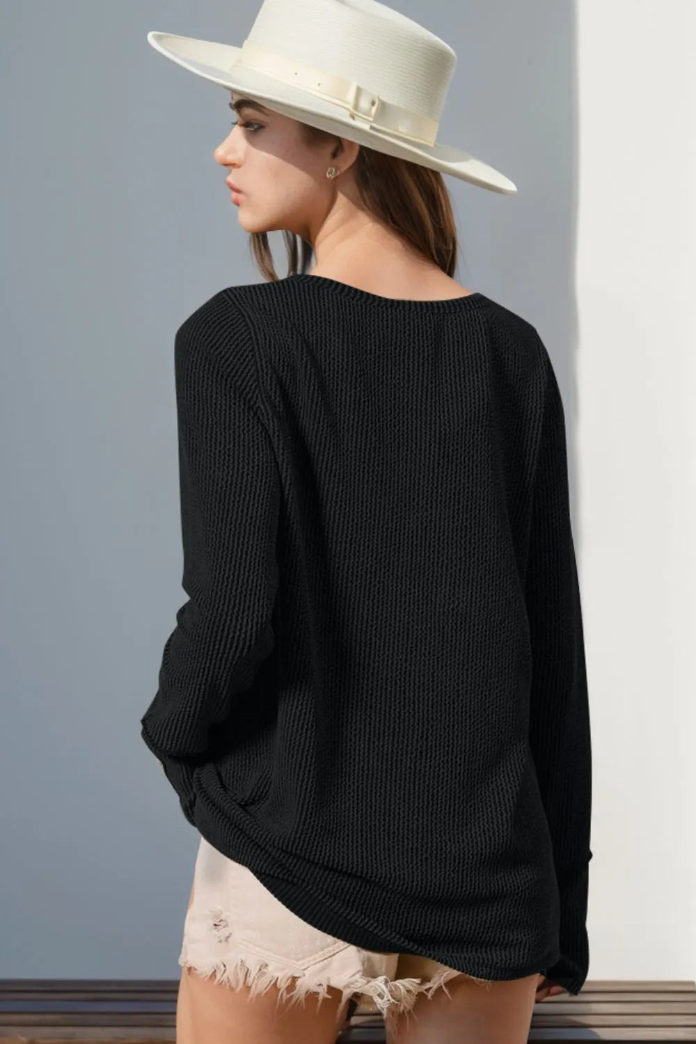 Long sleeve T-shirt with notched thumbholes, designed by Trendsi, featuring a full-size fit and casual style.