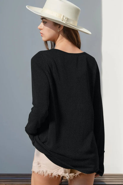 Long sleeve T-shirt with notched thumbholes, designed by Trendsi, featuring a full-size fit and casual style.