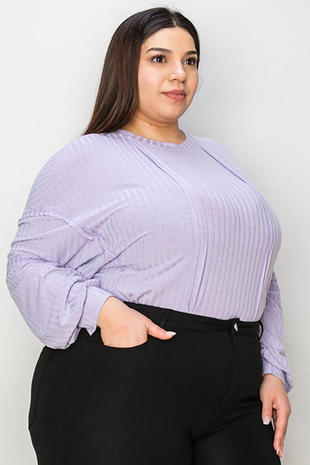 Trendsi Basic Bae full-size ribbed long sleeve T-shirt with round neck, featuring a fitted ribbed fabric in a casual style.