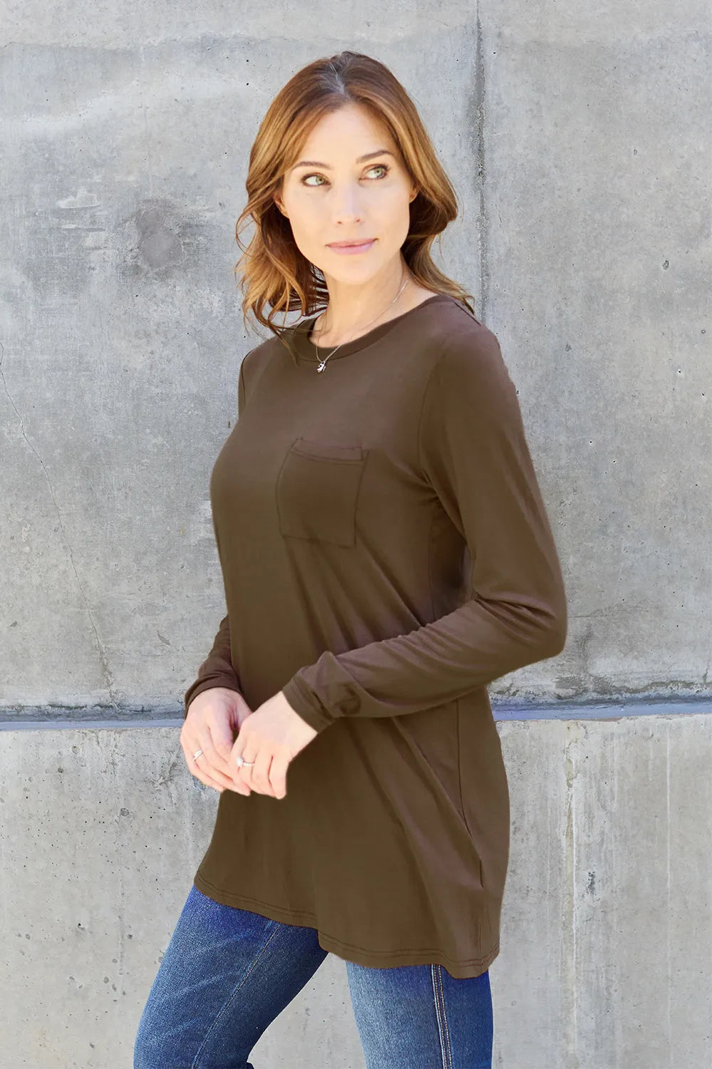 Long sleeve round neck top from Basic Bae by Trendsi, featuring a simple, classic design in neutral fabric.