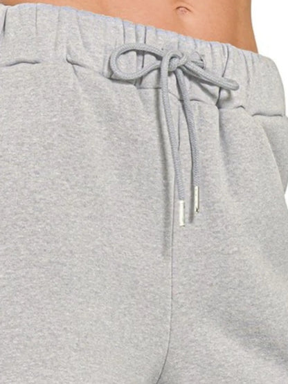 Zenana fleece drawstring short pants with pockets, casual loungewear, soft fabric, and comfortable fit, shown in black.