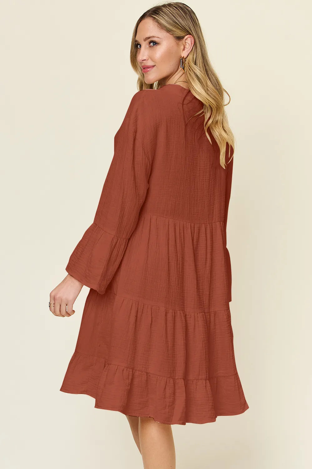 Plus size Trendsi Double Take full size textured button-up dress with ruffle hem, showcasing its stylish design and fabric details.