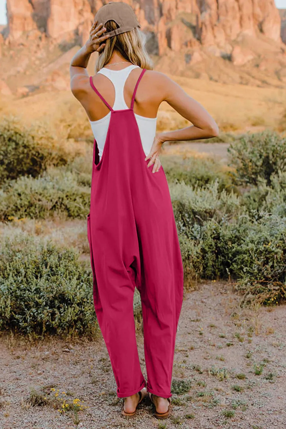Double Take full size V-neck sleeveless jumpsuit with pockets, featuring a stylish fit and modern design by Trendsi.