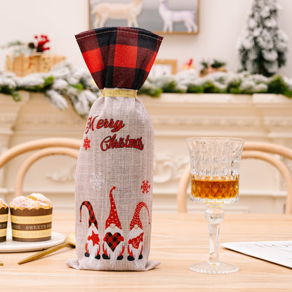 Two Christmas plaid wine bottle covers with festive red and green patterns, designed to decorate wine bottles during the holiday season.